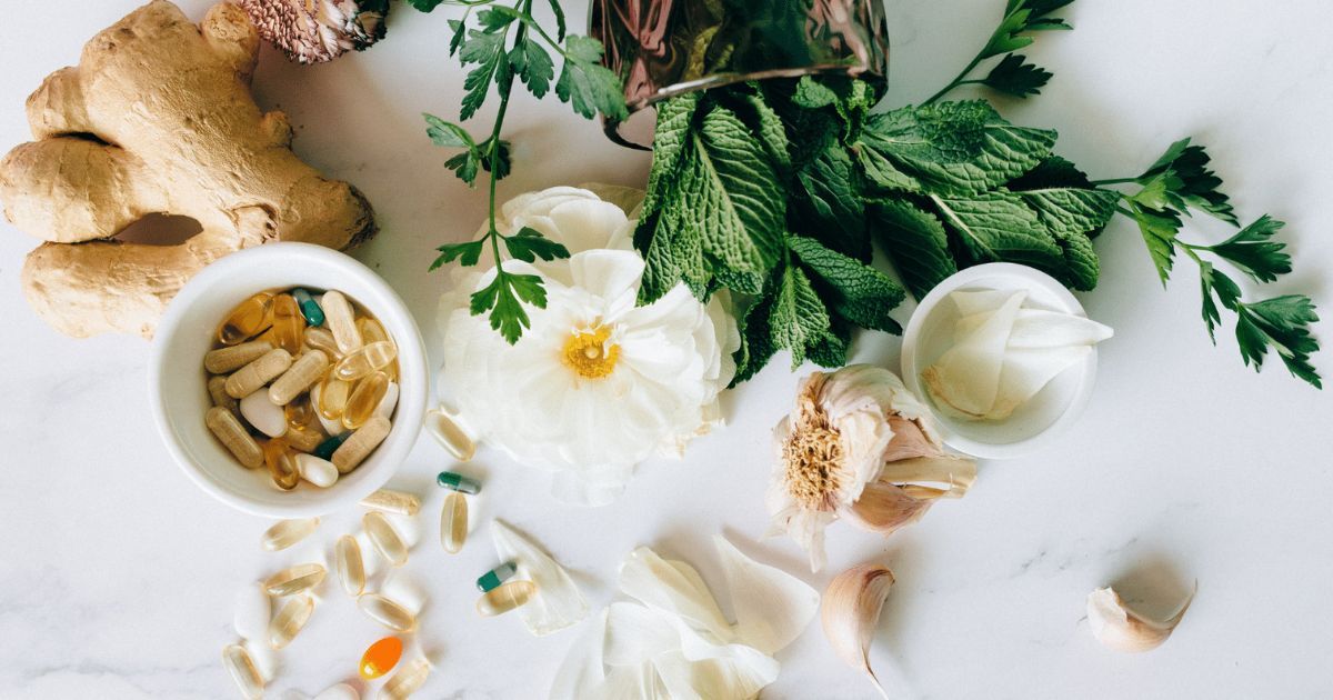 layout of vitamins and vitamin rich plants like ginger, cilantro, and garlic