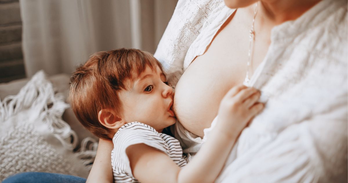 woman breastfeeding child