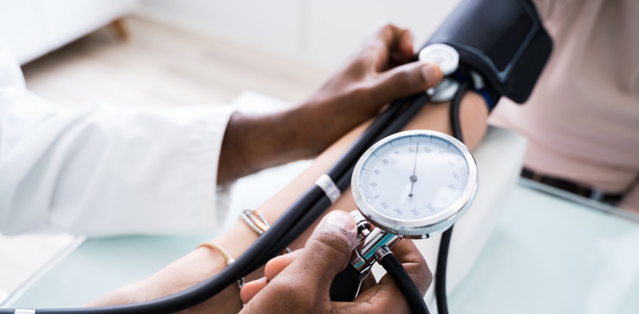 person getting their blood pressure taken