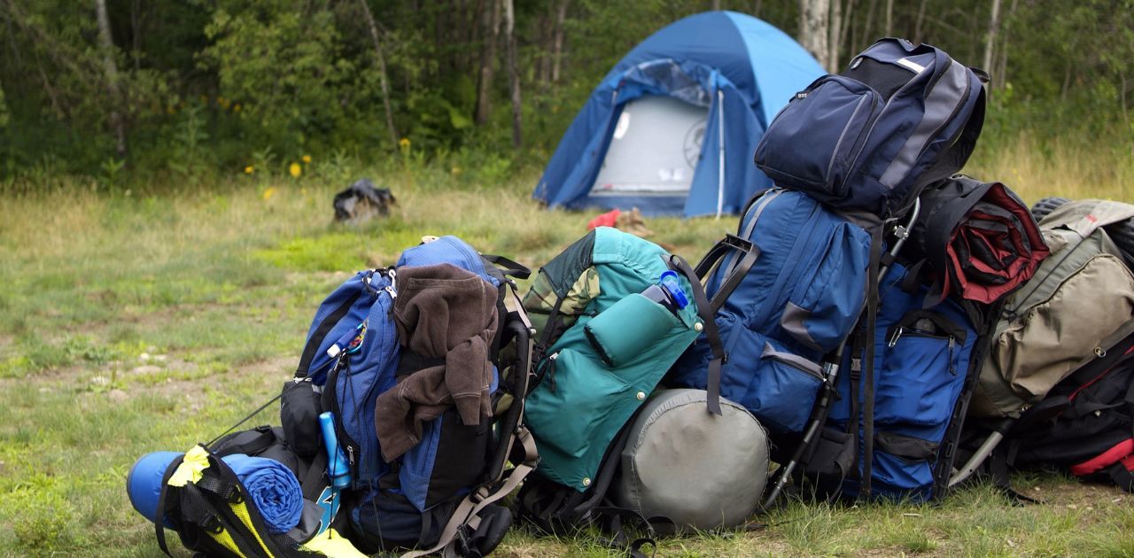 bunch of backpacks laid out