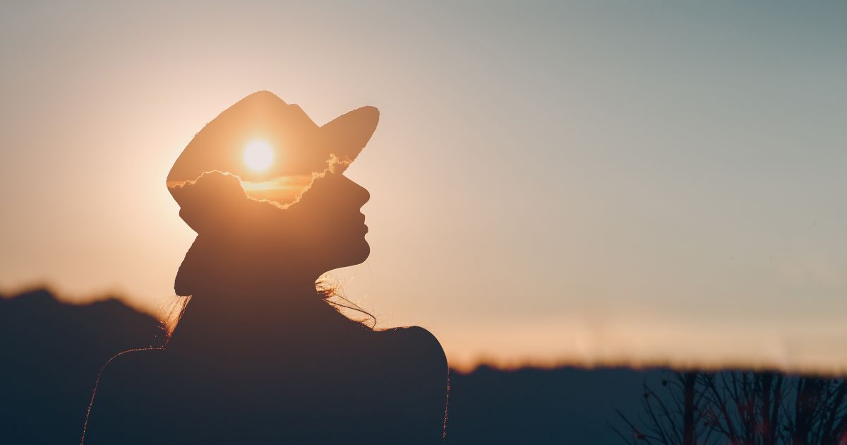 silhouette of woman during sunset
