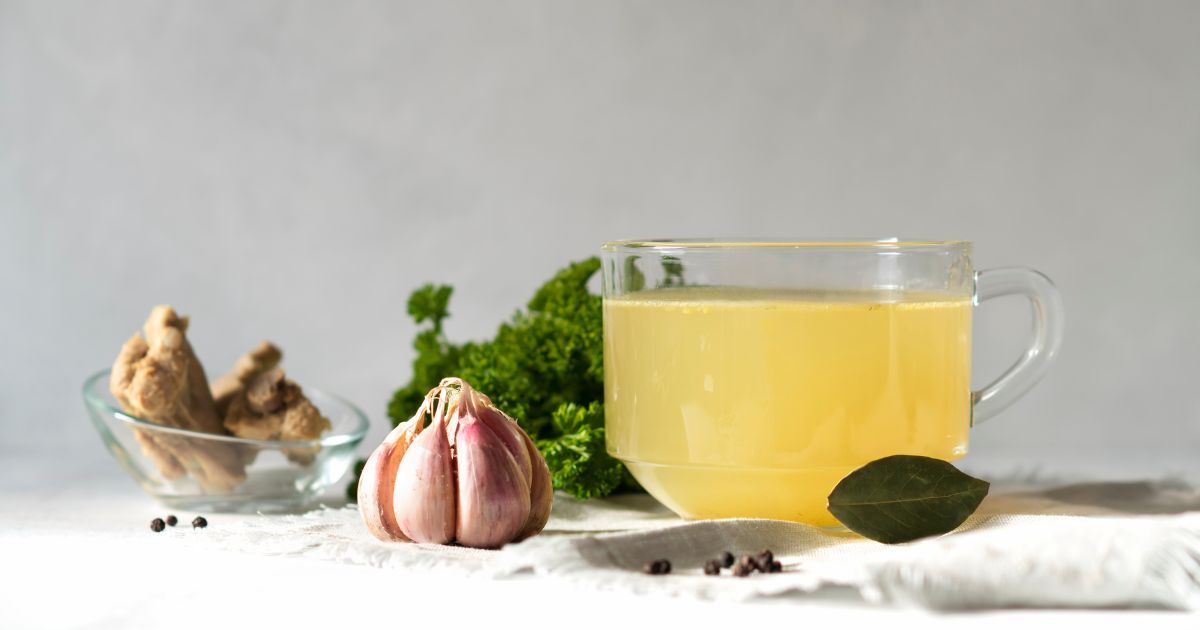 ginger garlic and bone broth in a cup