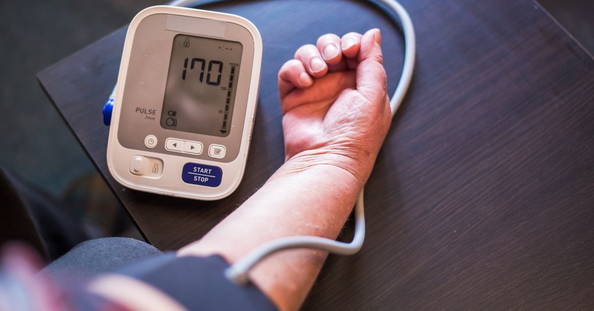 arm of a person taking blood pressure