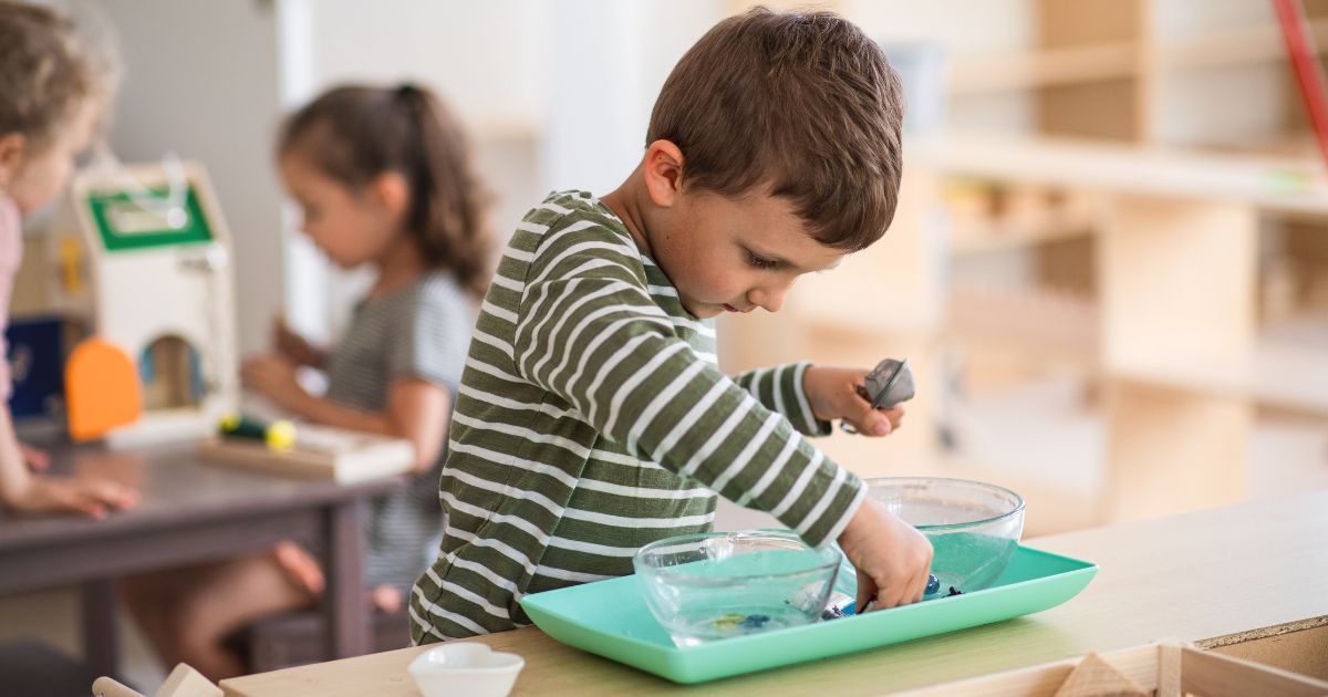 boy playing indoors in a Montessori classroom