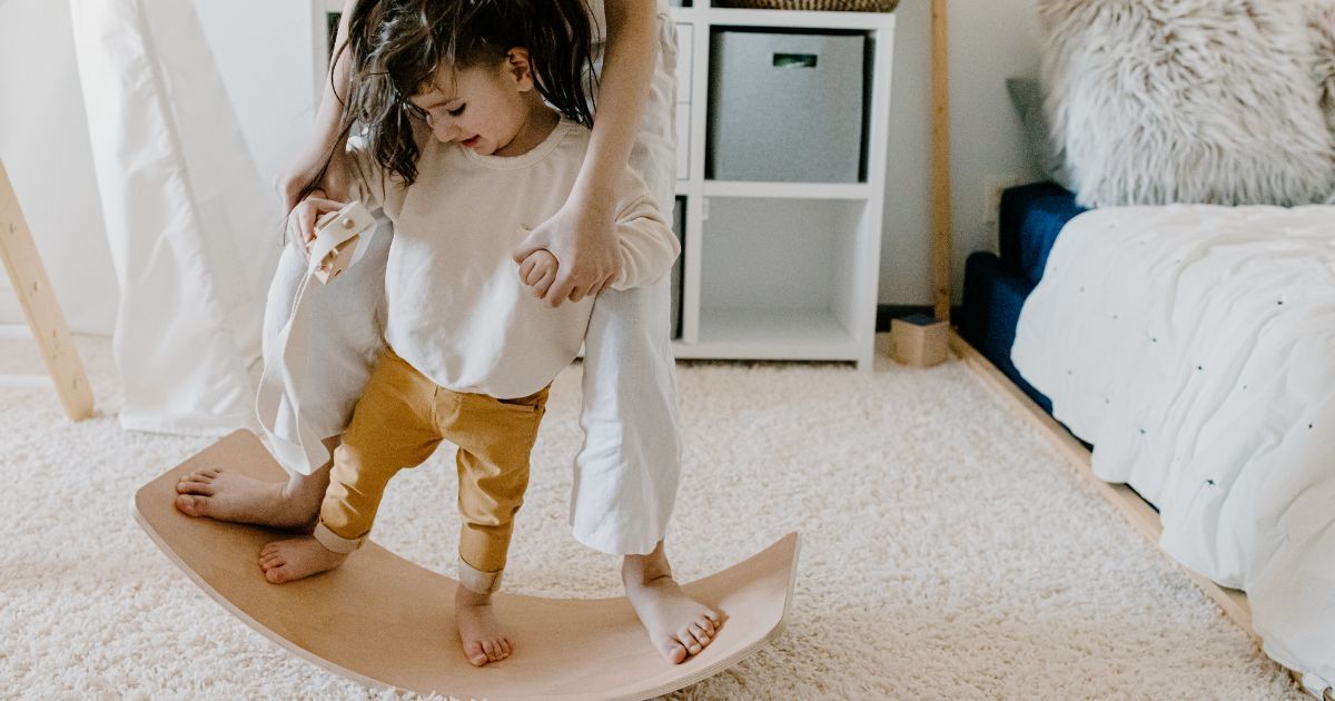 boy and girl playing on balance board