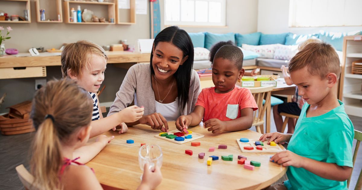 teacher and pupils using wooden shapes in a Montessori classroom