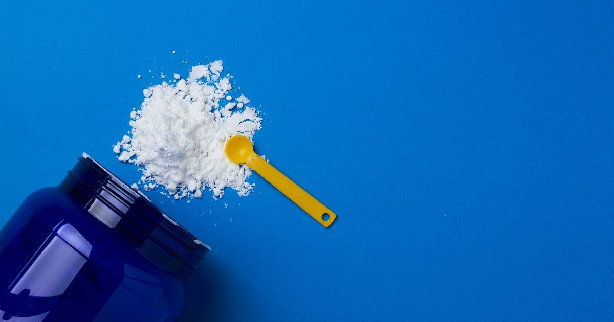 bottle of creatine and scoop