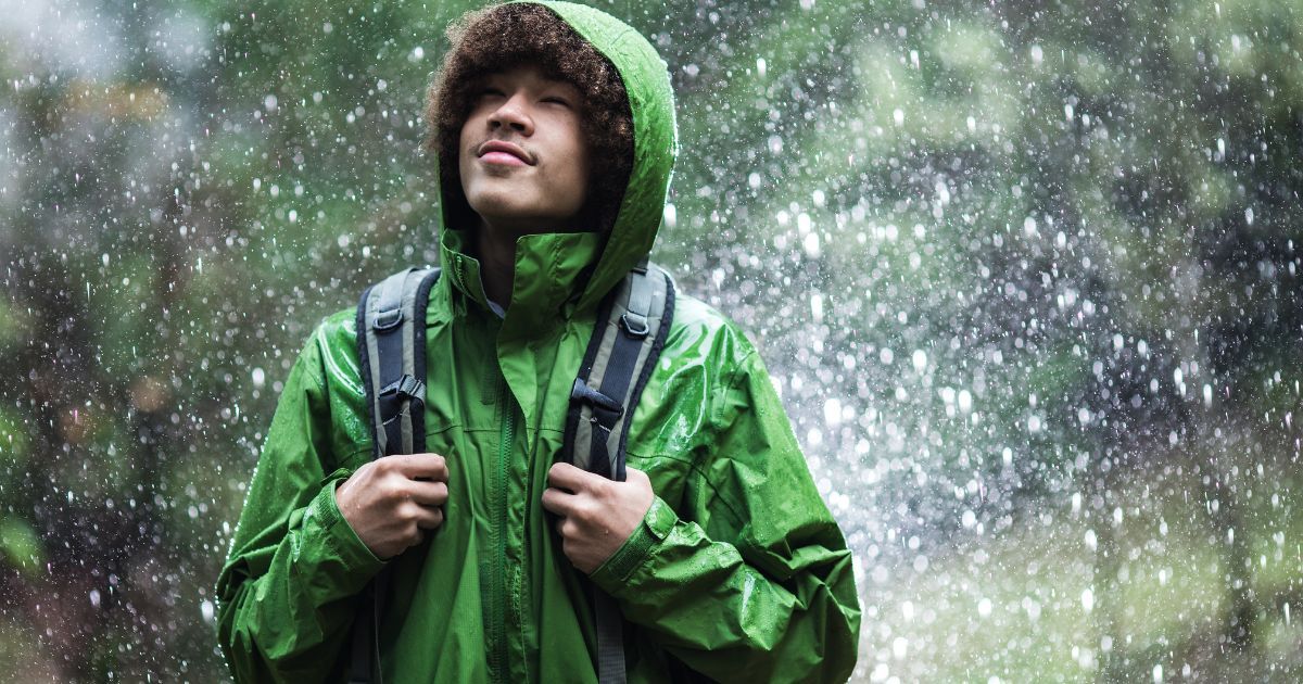 man standing in rain