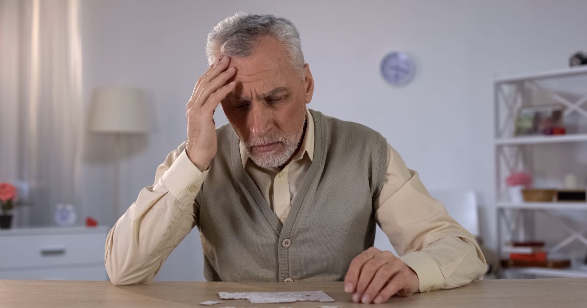 older man working on puzzle