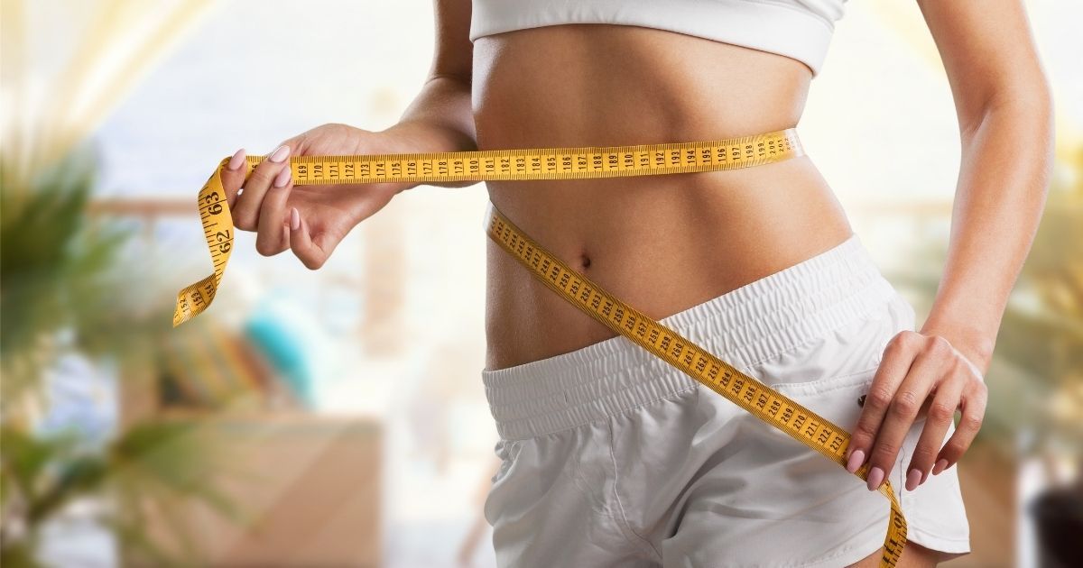 woman measuring waist