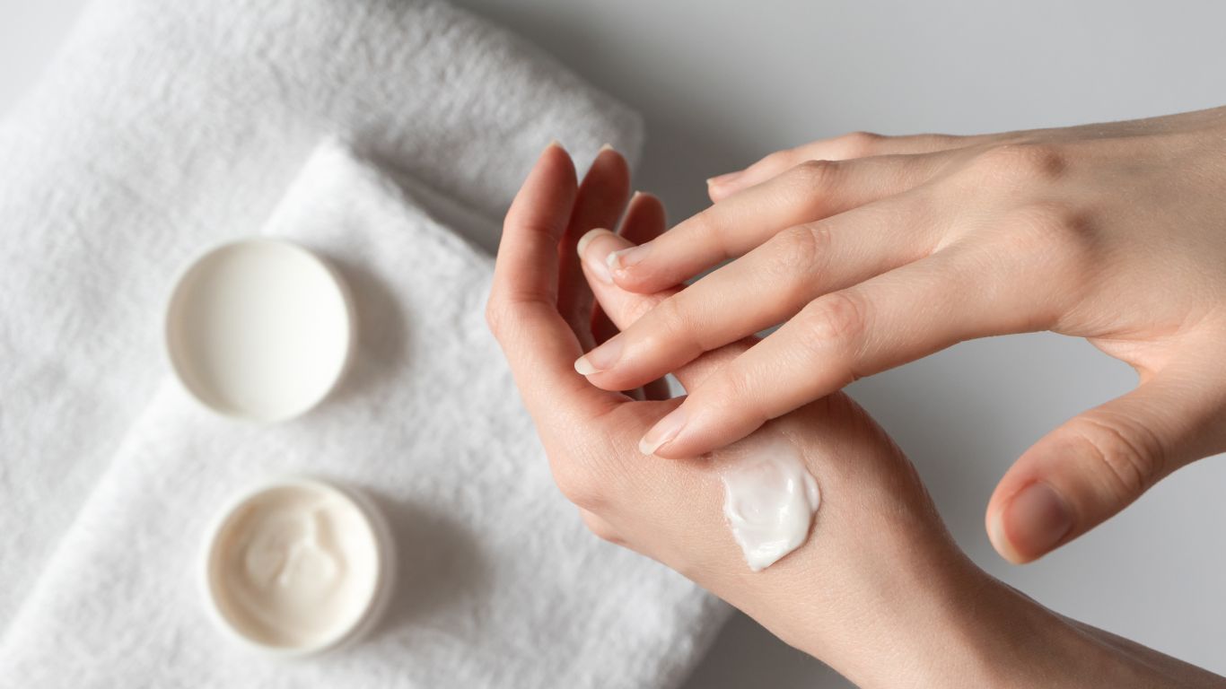 putting cream on hands