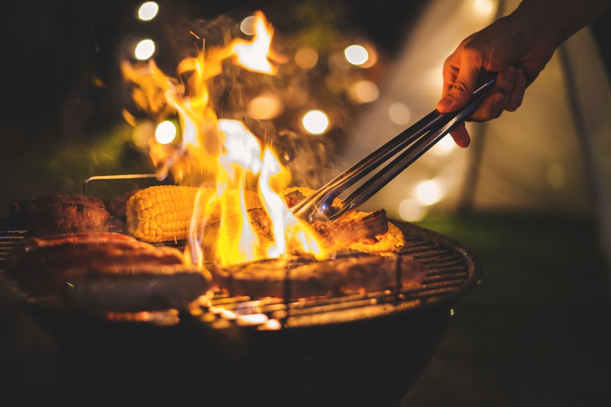 bbq grill with food cooking on it