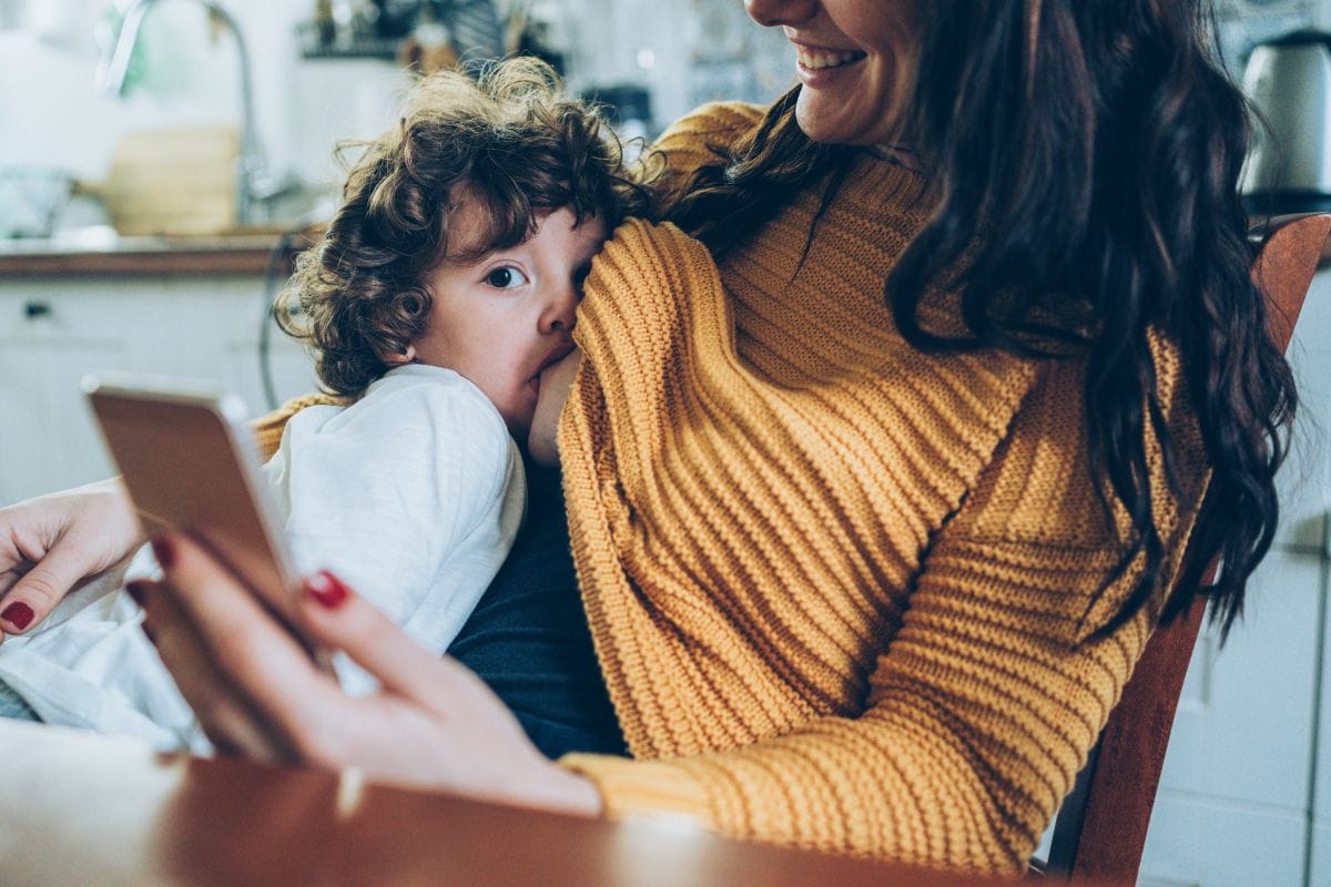 woman breastfeeding toddler