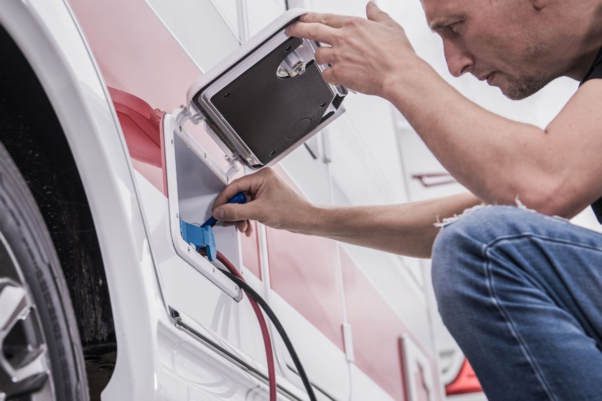 man inspecting rv electrical
