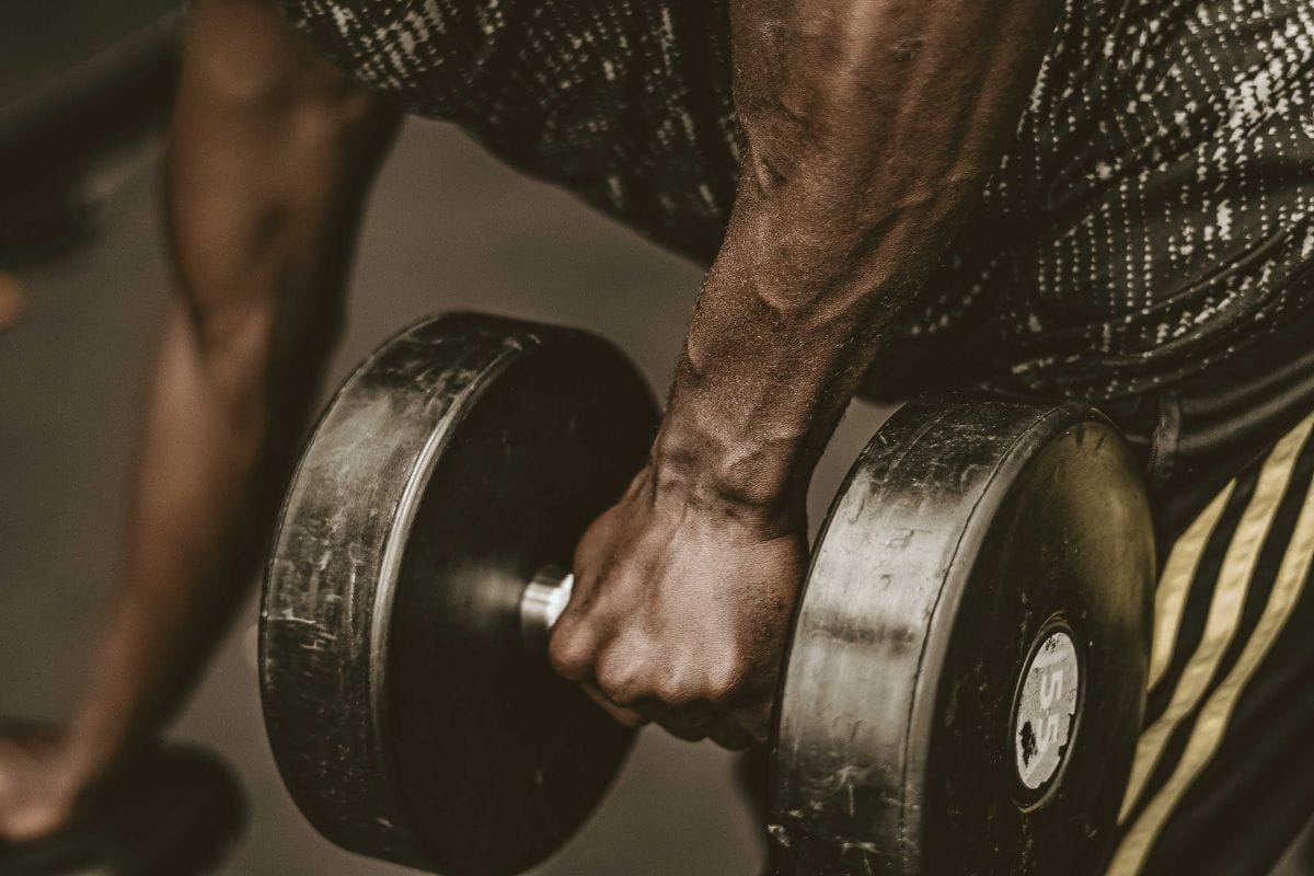 man using dumbell